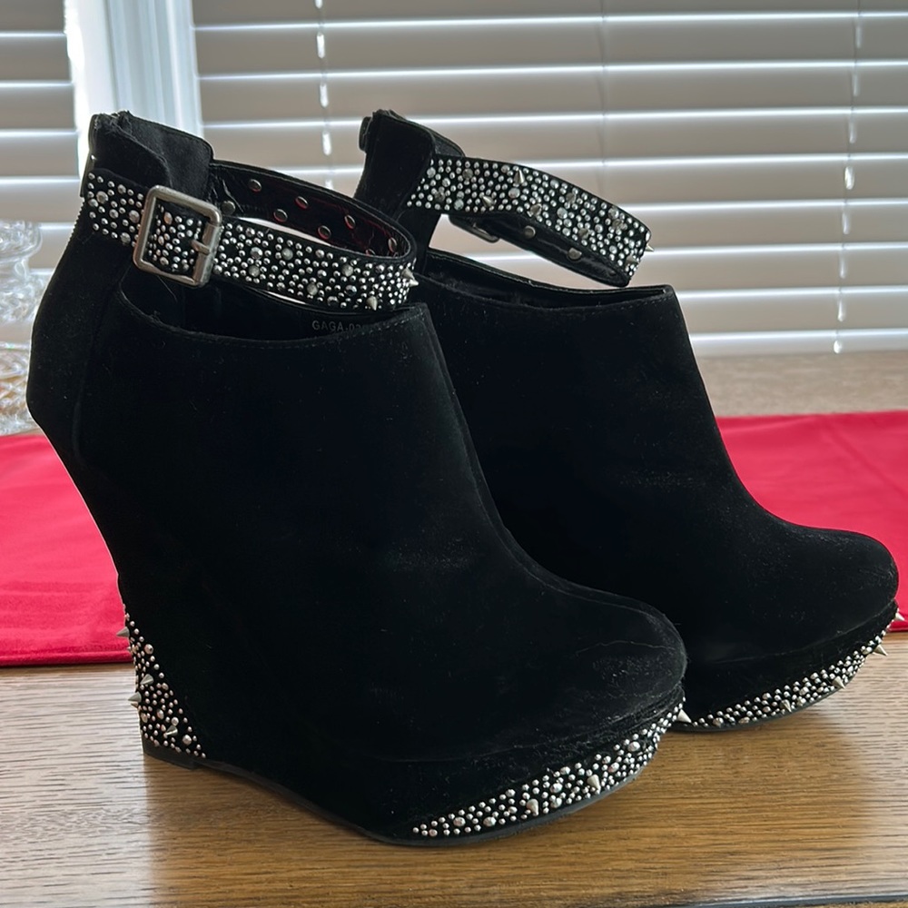 Black wedge booties with silver spikes
